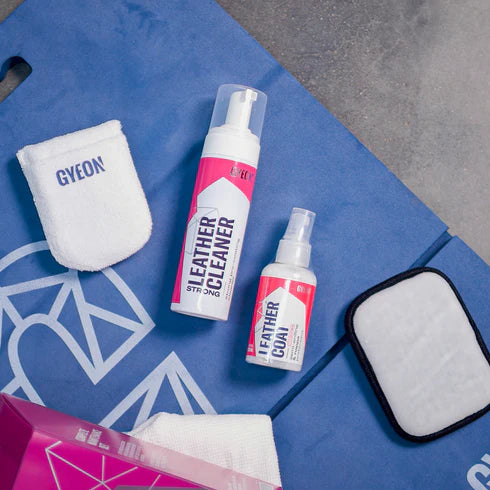 Flat lay of GYEON Q²M Leather Set Strong featuring items like the leather cleaner, coating, and applicators.