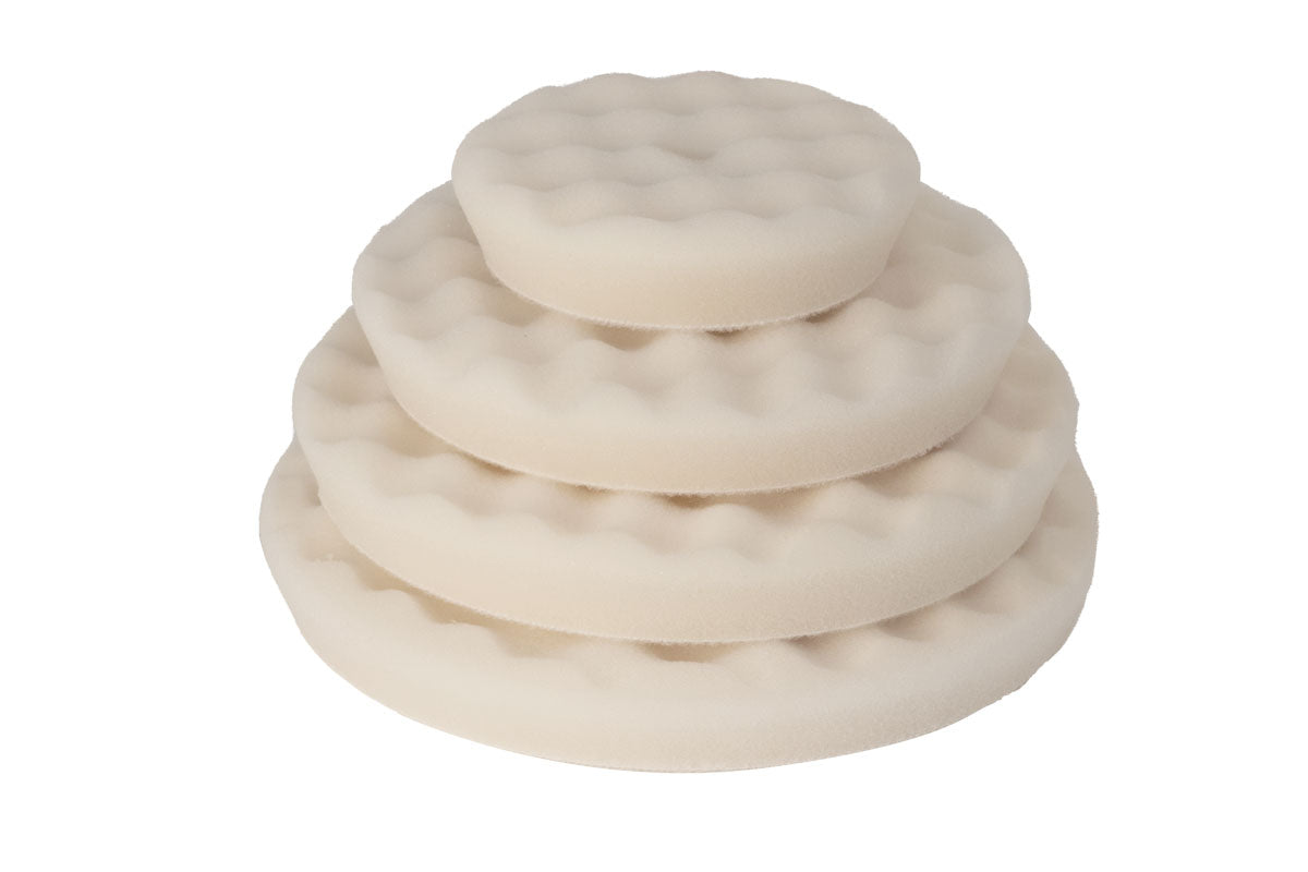Stack of RUPES WAFFLE ULTRA-FINE Polishing Foam pads from largest to smallest, showing various size options.