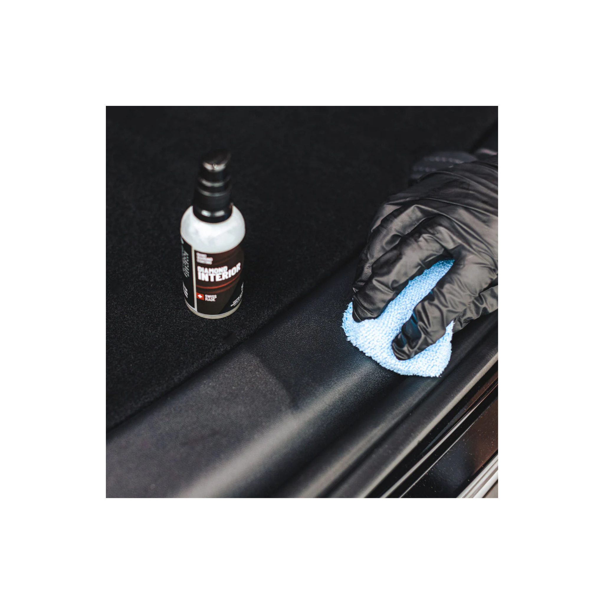 Gloved hand applying Diamond ProTech Diamond Interior to restore and enrich faded trim and surfaces. 