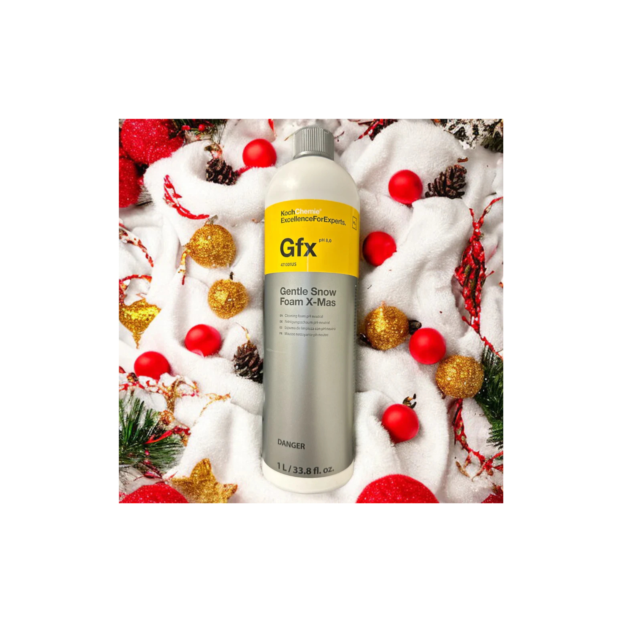 Bottle of Koch-Chemie Gentle Snow Foam X-Mas shown with a festive holiday background.