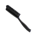 Koch-Chemie Upholstery Brush with firm bristles and ergonomic handle for cleaning fabric seats and carpets.