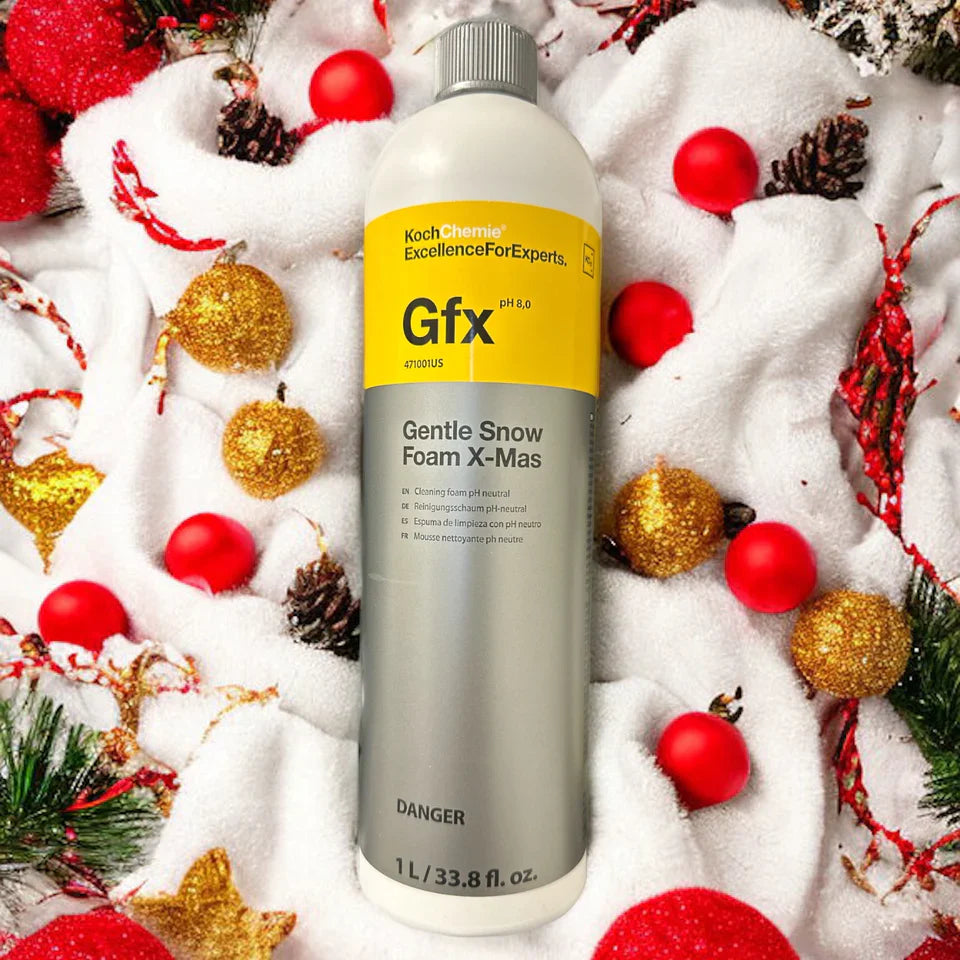 Bottle of Koch-Chemie Gentle Snow Foam X-Mas shown with a festive holiday background.