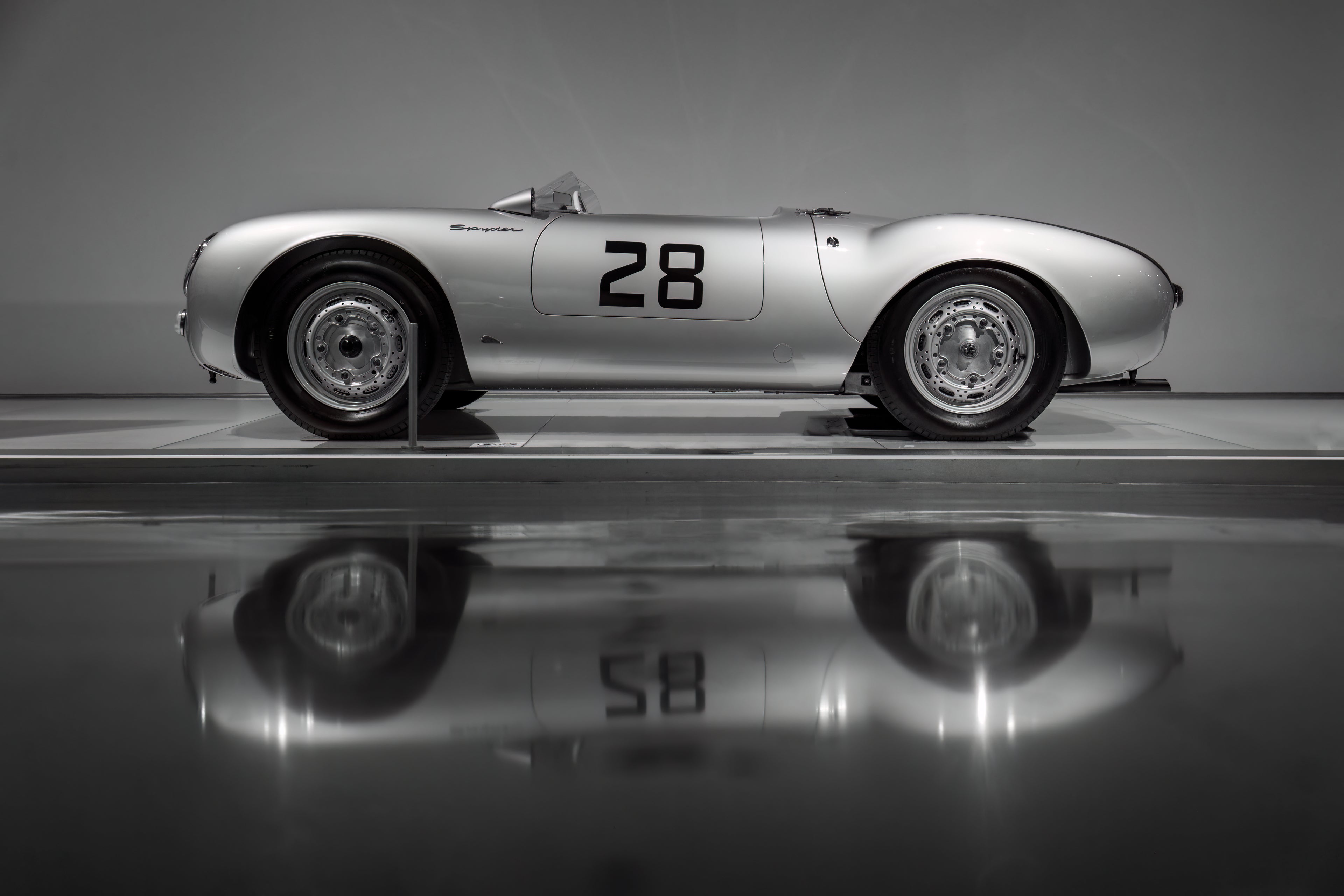 Vintage race car with number 28 on a reflective surface collection list at Supreme