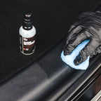 Gloved hand applying Diamond ProTech Diamond Interior to restore and enrich faded trim and surfaces. 