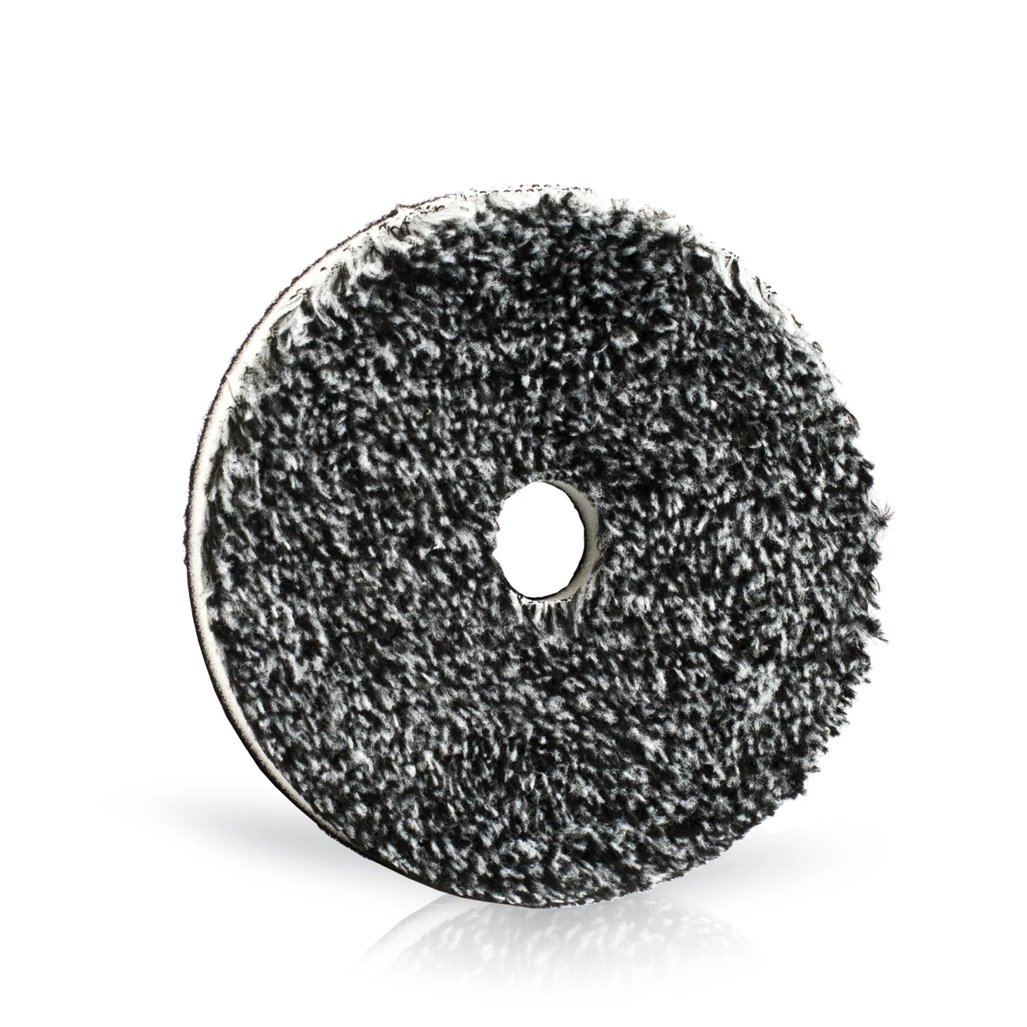 Buff and Shine URO Fiber black and white cutting pad for aggressive paint correction and defect removal.