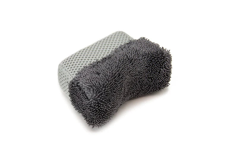 Autofiber Tire Saver Curved Dressing Applicator with Barrier Layer in medium size for tire dressing application.